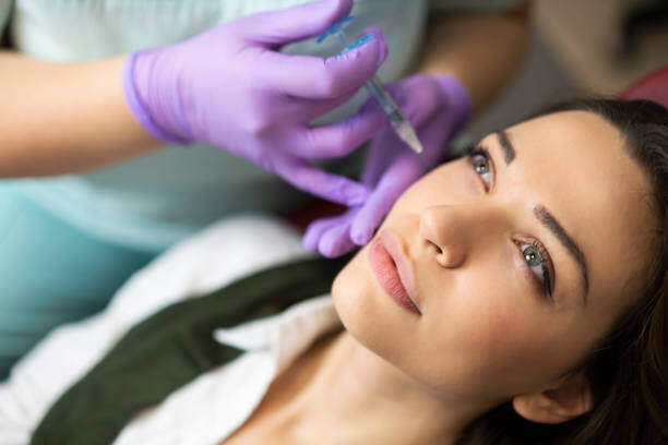 Young woman receiveing a dermal filler injection.